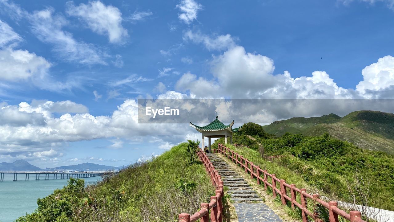 Panoramic view of footbridge against sky