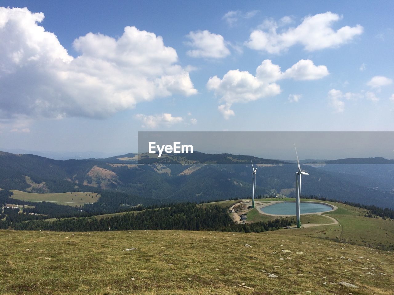 SCENIC VIEW OF LAND AND MOUNTAINS AGAINST SKY