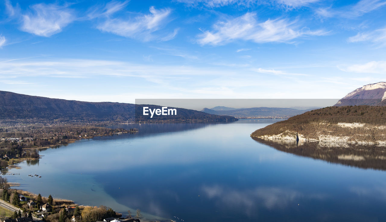 Scenic view of lake annecy and mountains against sky