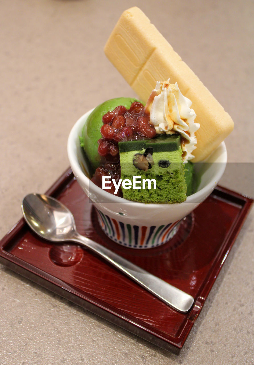 High angle view of green tea ice cream on table