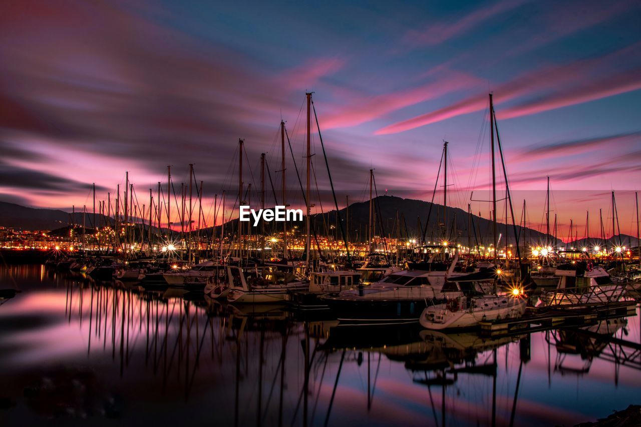 Boats moored at harbor