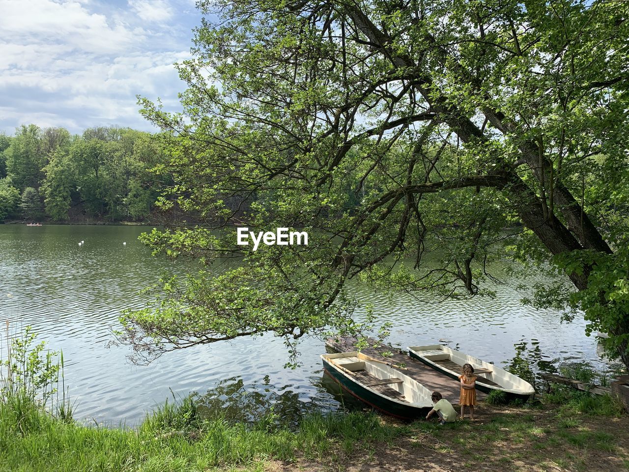 Boy and girl with a boat