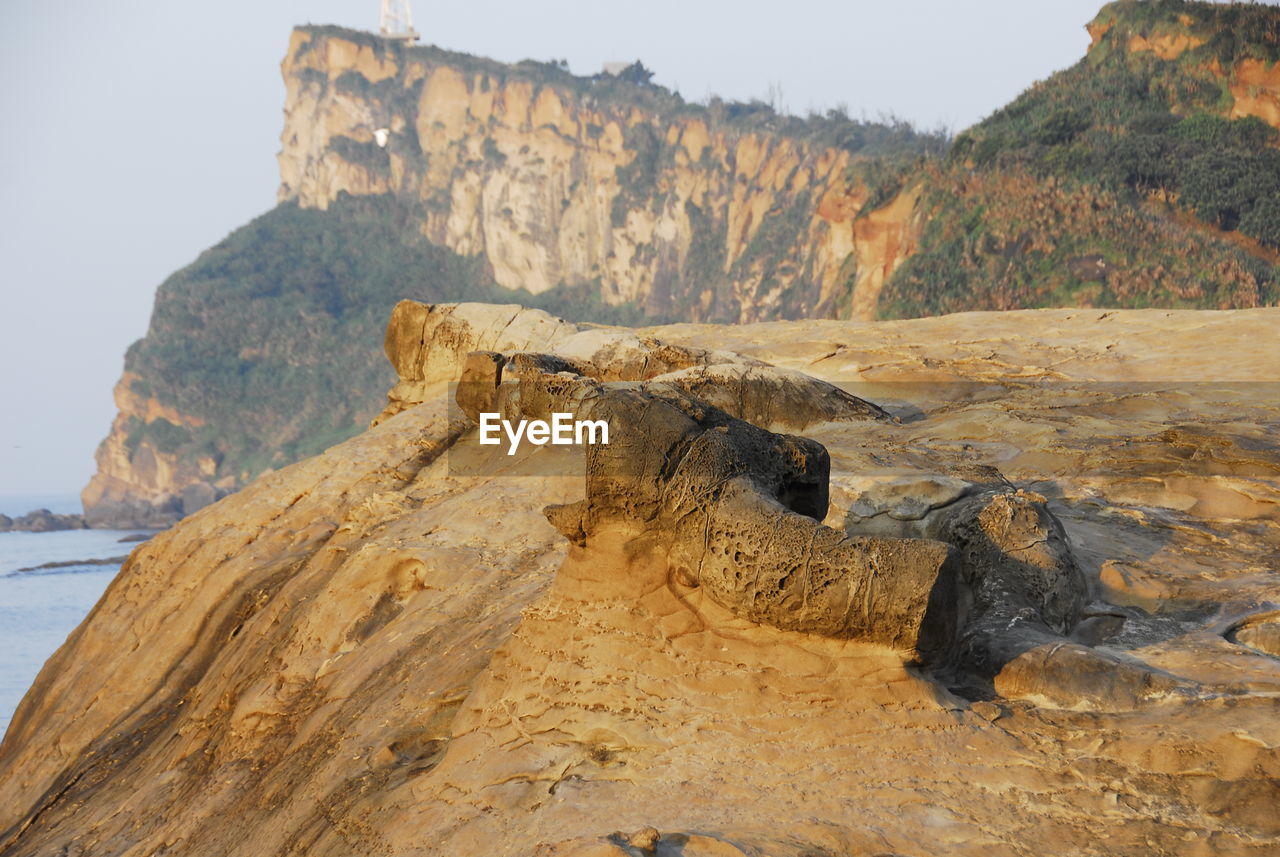 Scenic view of rock formation against sky