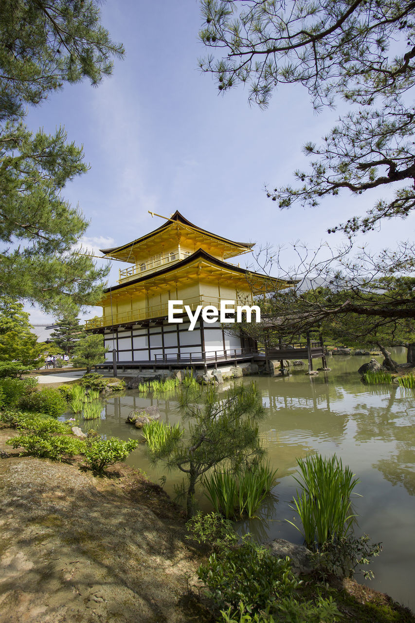 TEMPLE AGAINST BUILDING AND TREES