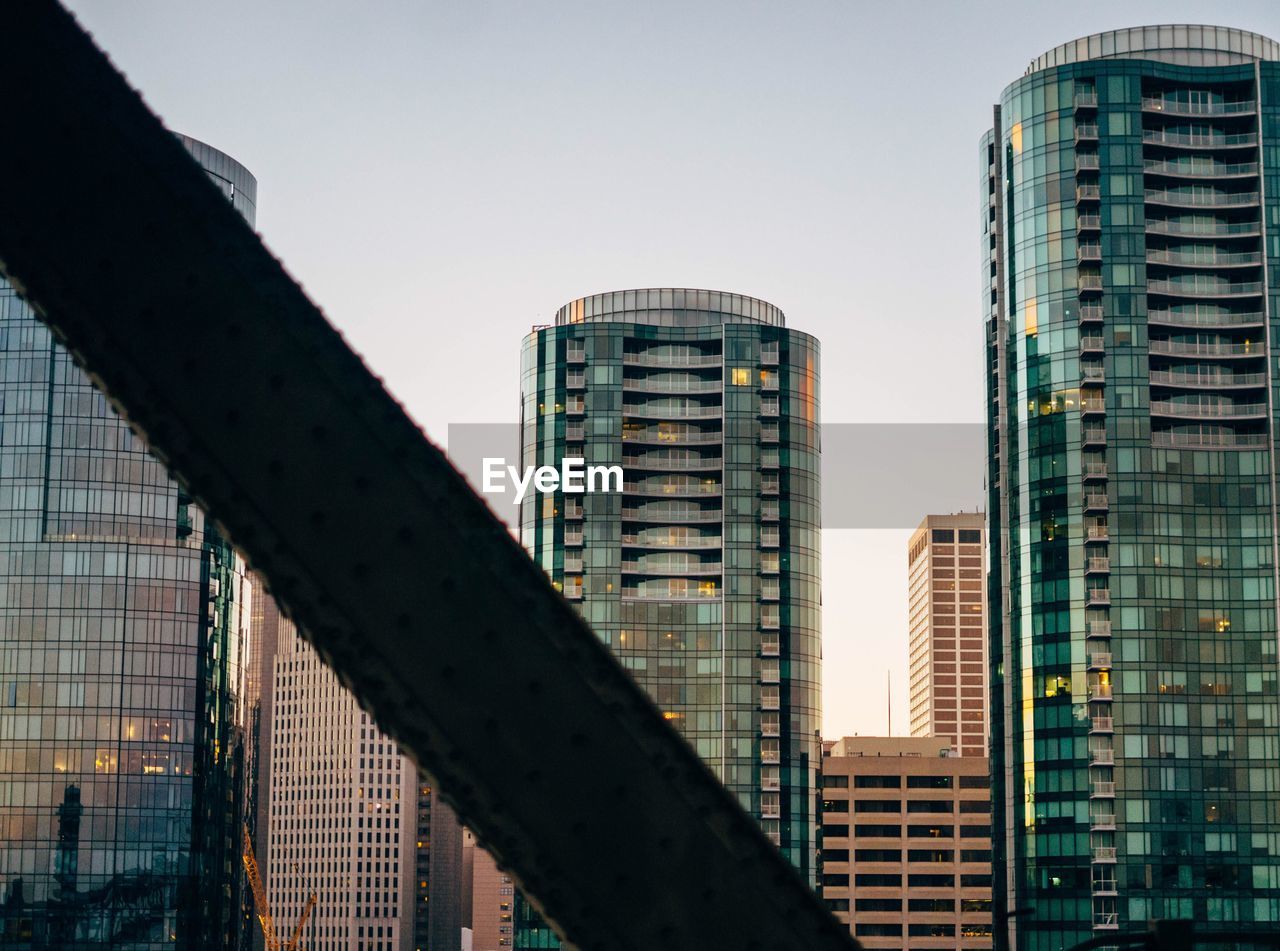 Low angle view of skyscrapers against clear sky