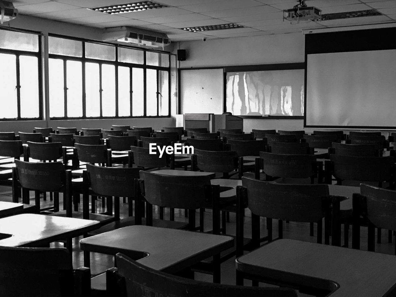 EMPTY CHAIRS AND TABLES IN RESTAURANT