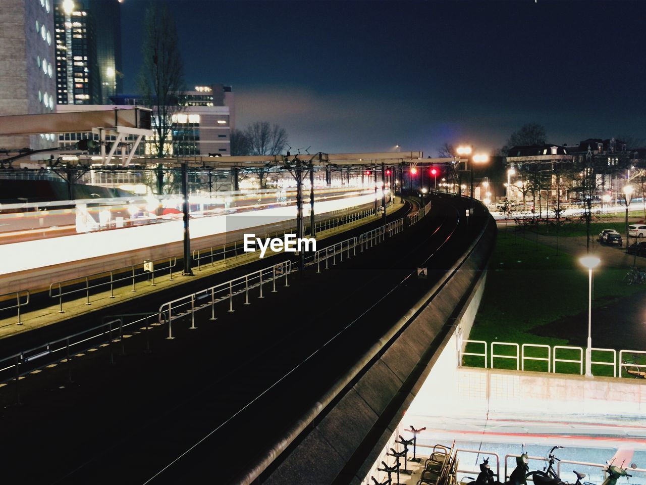 HIGH ANGLE VIEW OF RAILROAD STATION AT NIGHT