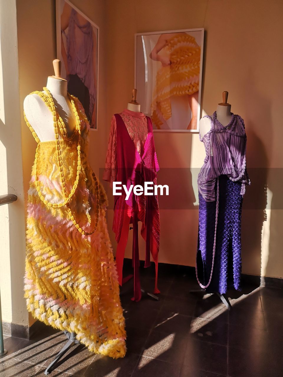 clothing, dress, fashion, indoors, yellow, human representation, mannequin, retail, shopping, store, no people, boutique, clothing store, textile, full length, elegance