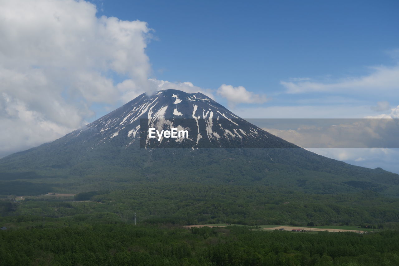 View of mountain landscape against cloudy sky