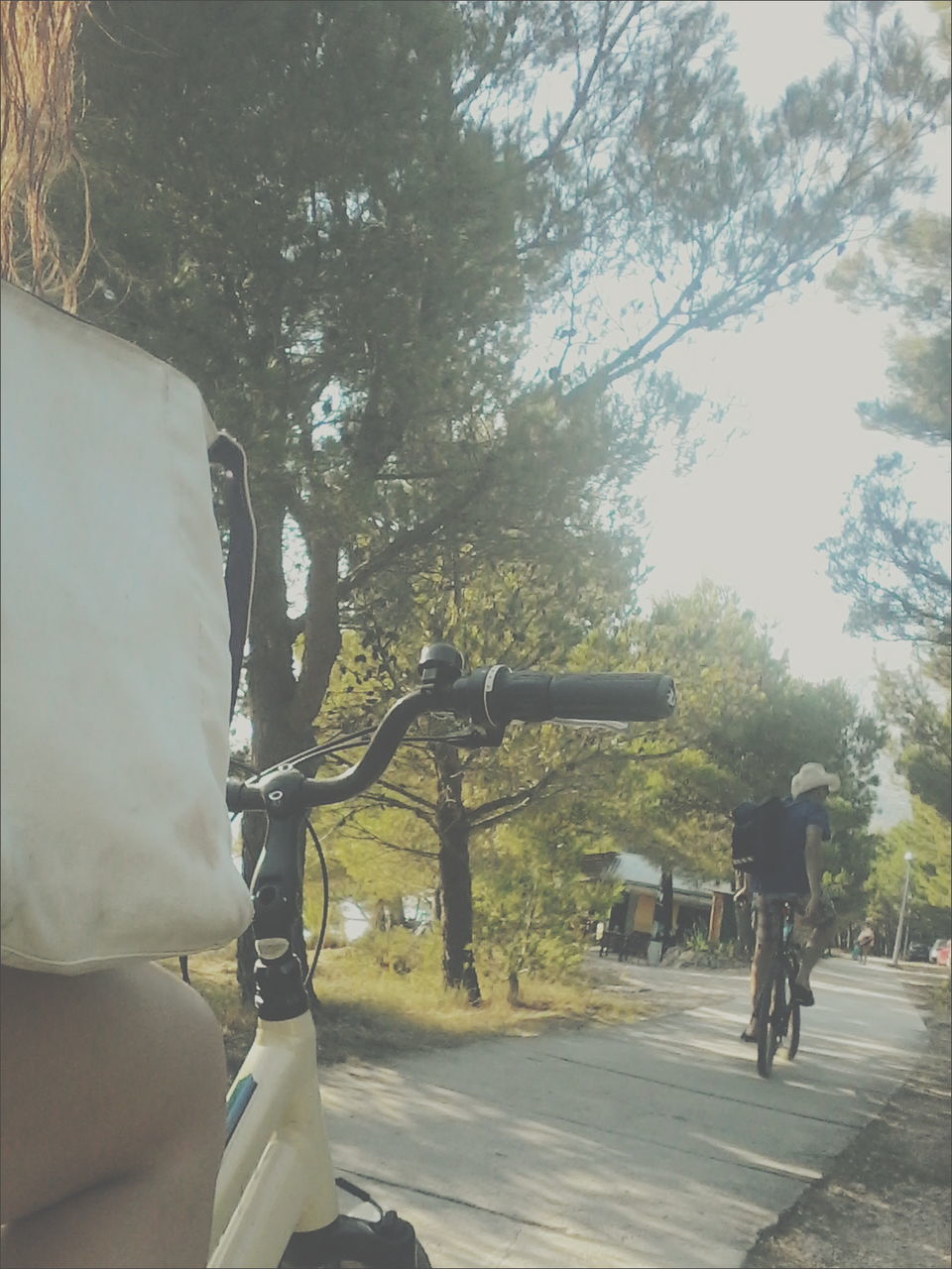 TWO PEOPLE WALKING ON ROAD