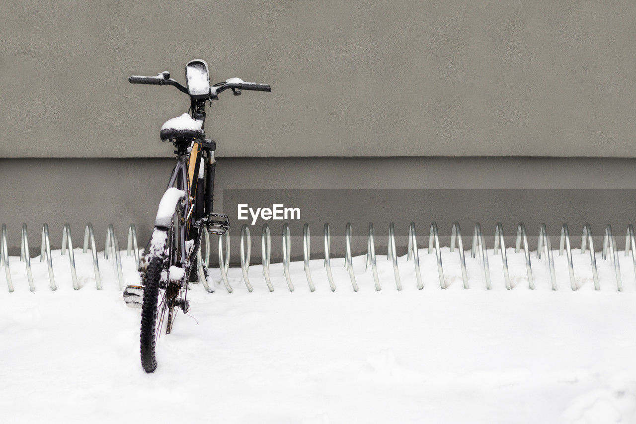 Bicycle on street in snowy winter day