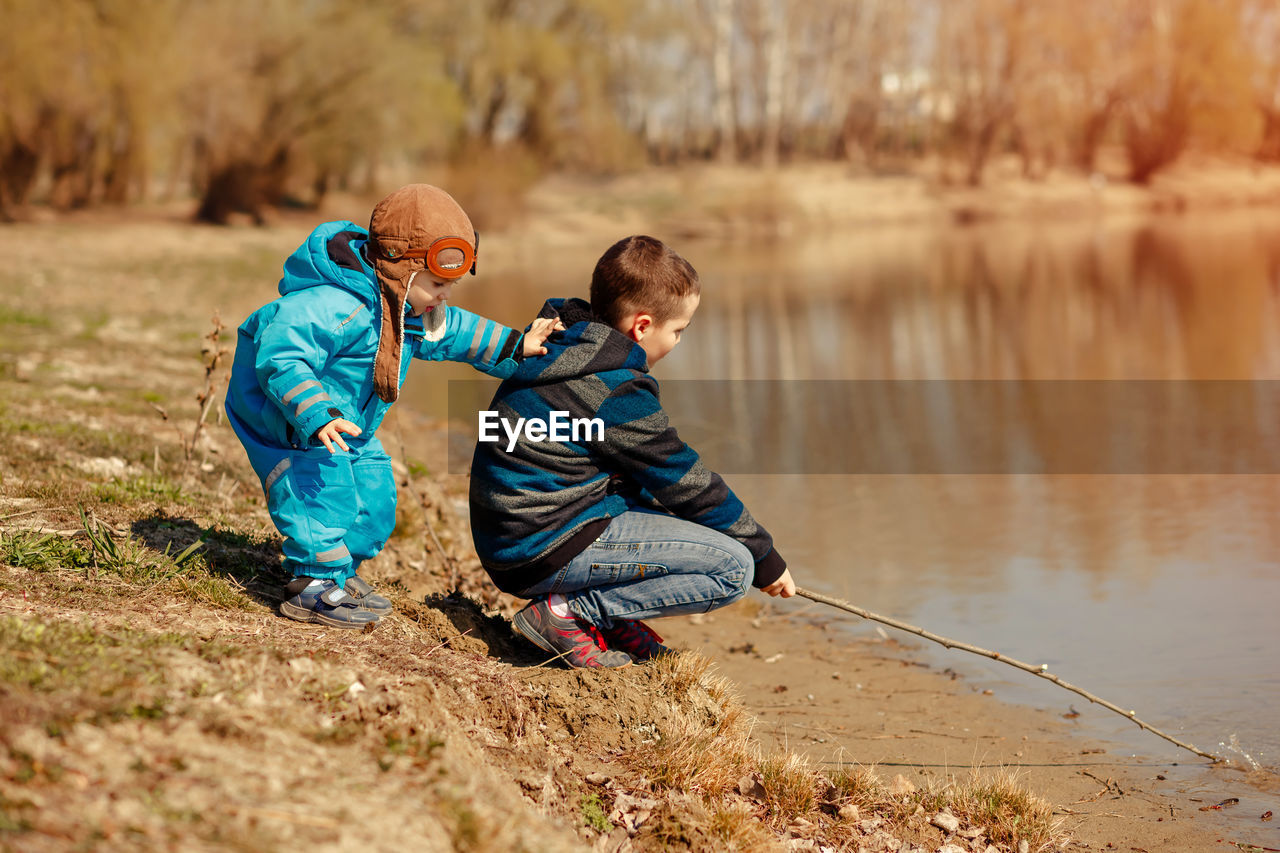 Father and son in water