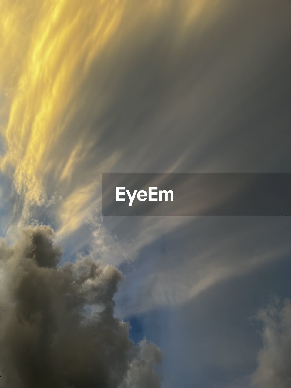 sky, cloud, dramatic sky, beauty in nature, cloudscape, nature, storm, sunlight, no people, scenics - nature, sunset, storm cloud, low angle view, tranquility, overcast, environment, moody sky, backgrounds, idyllic, outdoors, tranquil scene, thunderstorm, atmosphere, awe, meteorology, sunbeam, atmospheric mood