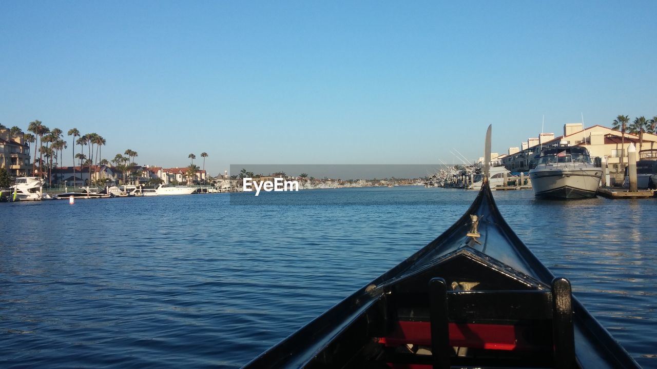 Boats moored at harbor