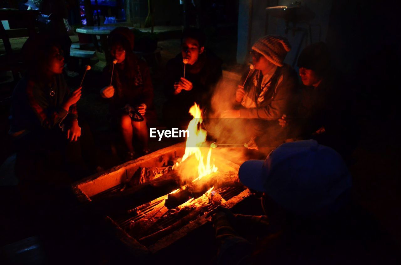 GROUP OF PEOPLE IN COOKING PAN