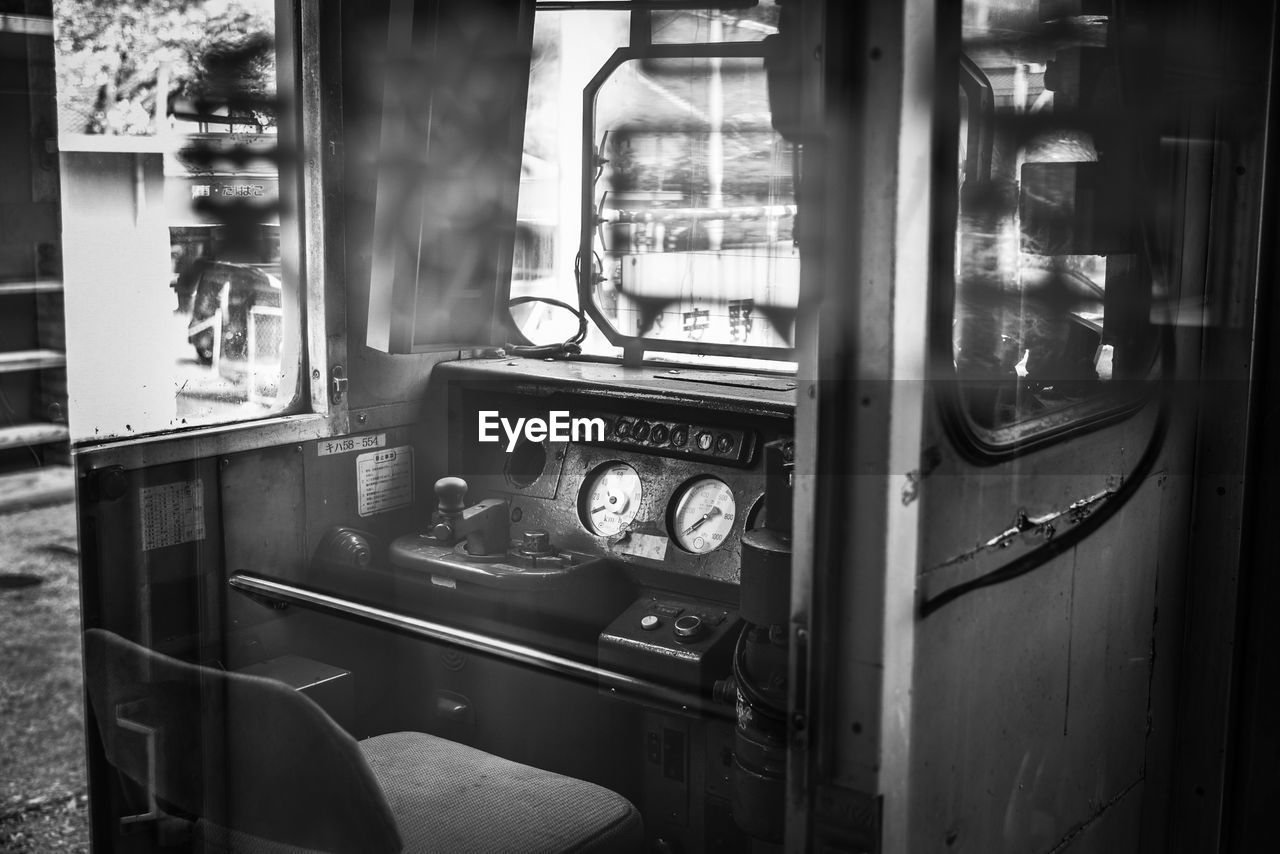 CLOSE-UP OF TRAIN SEEN THROUGH WINDOW OF RAILROAD STATION