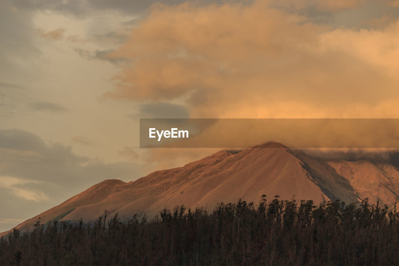 Scenic view of mountains against sky during sunset