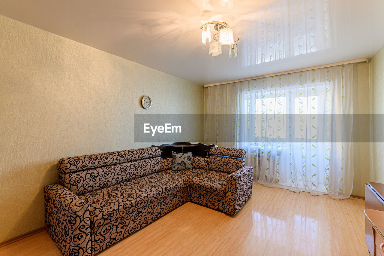 Electric lamp on wooden floor at home