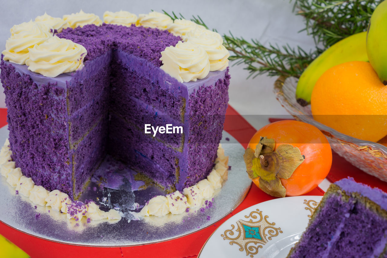 Close-up of cake and fruits on table during christmas