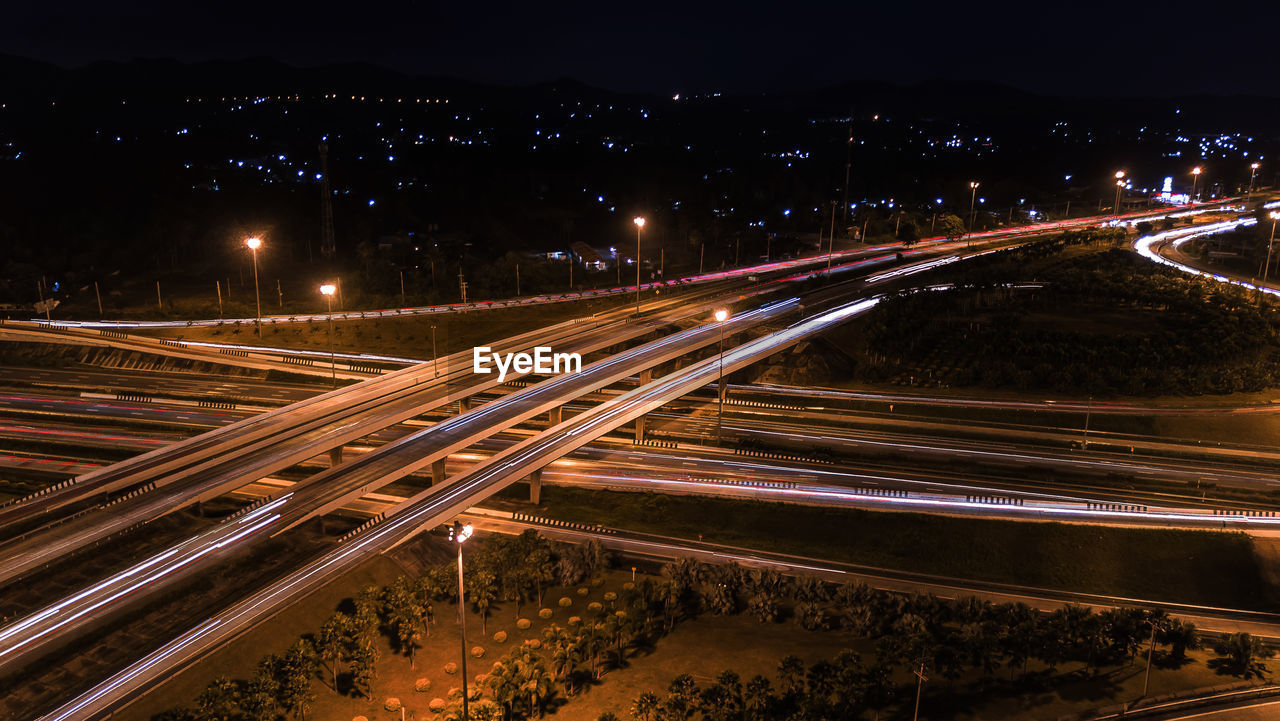 High angle view of light trails on road at night