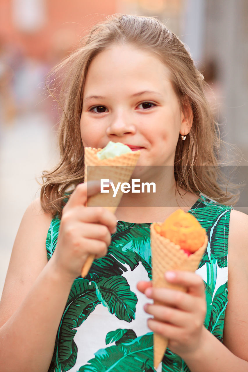 Portrait of cute girl eating ice cream