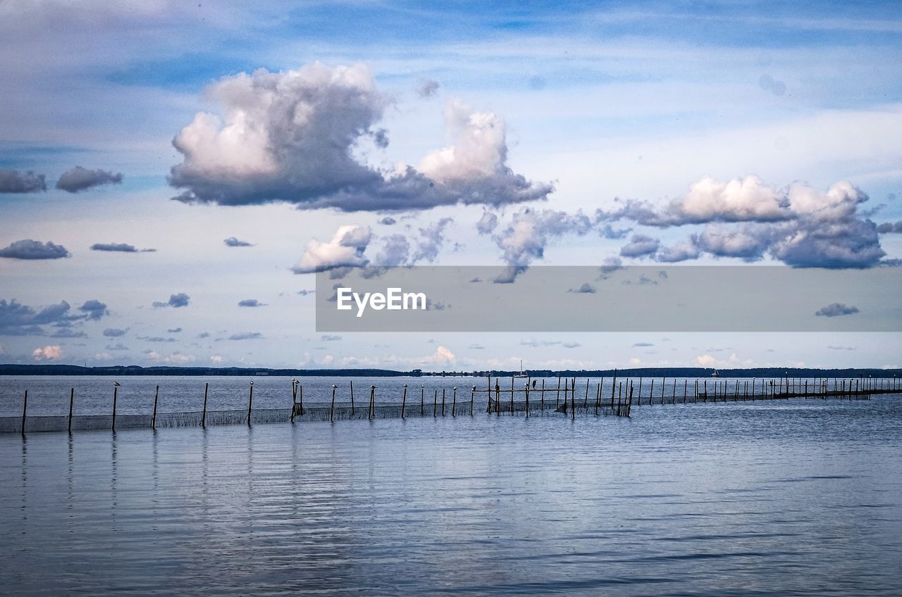 water, sky, cloud, horizon, sea, reflection, nature, beauty in nature, scenics - nature, ocean, morning, environment, tranquility, dusk, wave, no people, shore, blue, landscape, tranquil scene, outdoors, land, travel destinations, sunlight, travel, beach, day, pier, architecture, horizon over water, coast, idyllic, seascape, lagoon