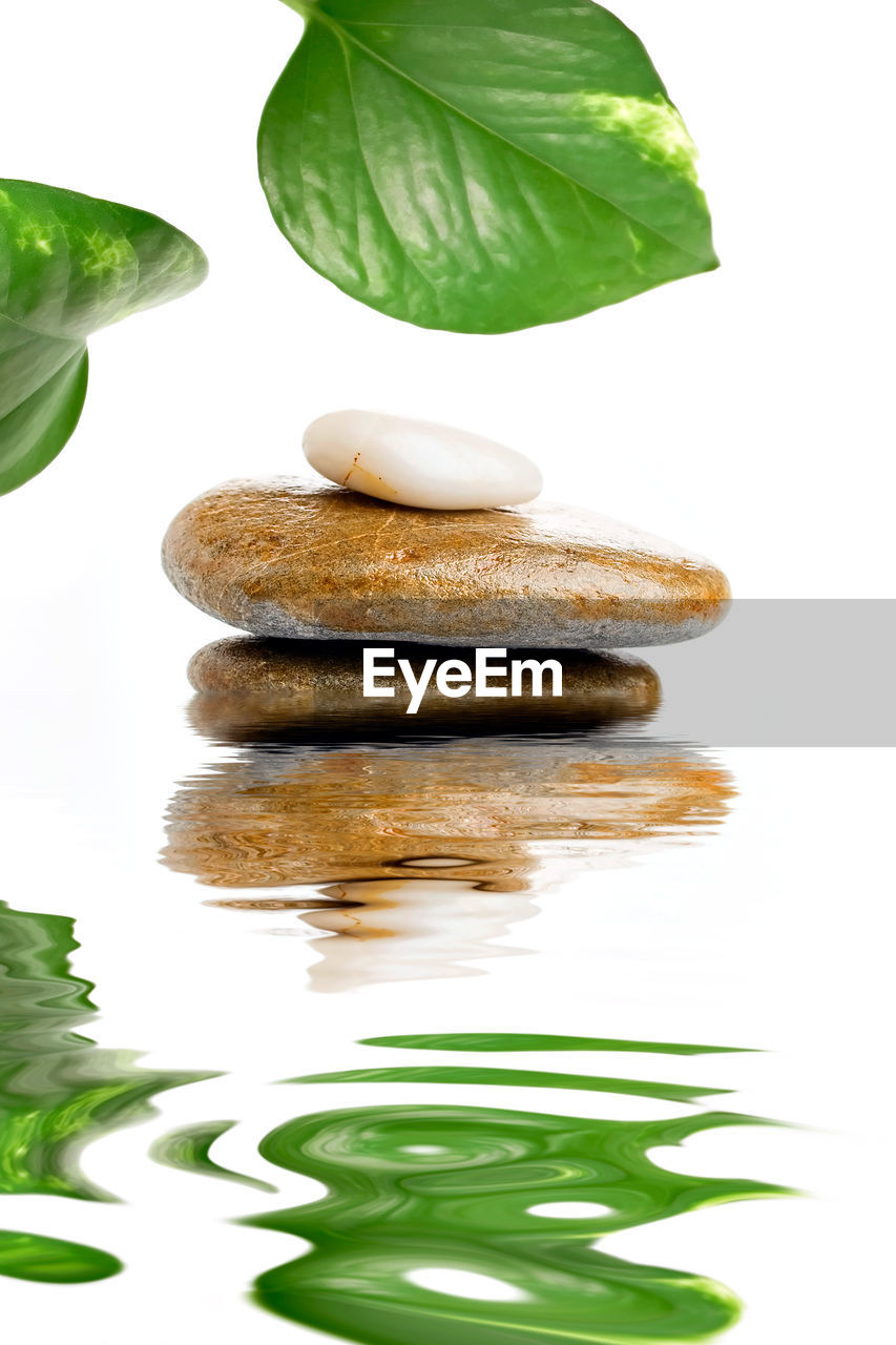 CLOSE-UP OF STACK OF PEBBLES