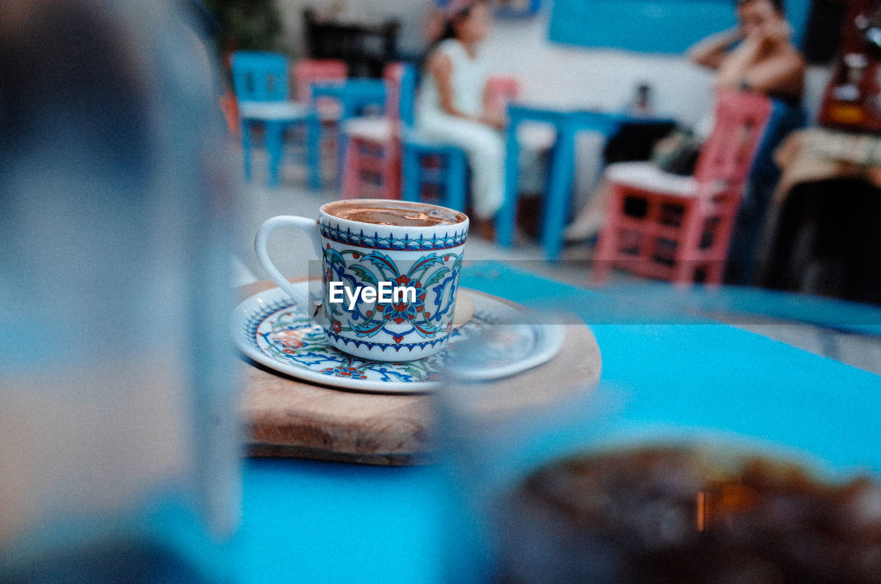 CLOSE-UP OF COFFEE SERVED ON TABLE