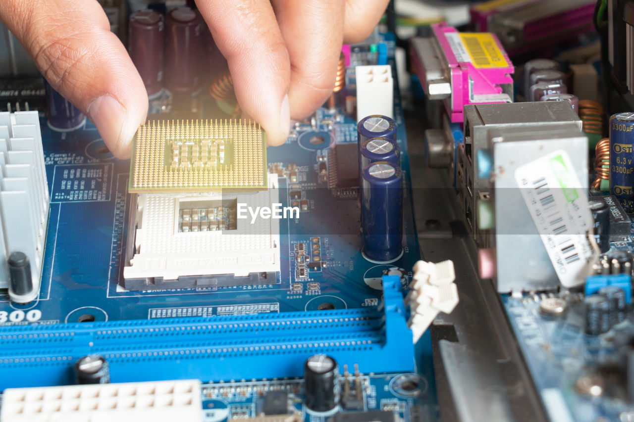 High angle view of hand holding cpu