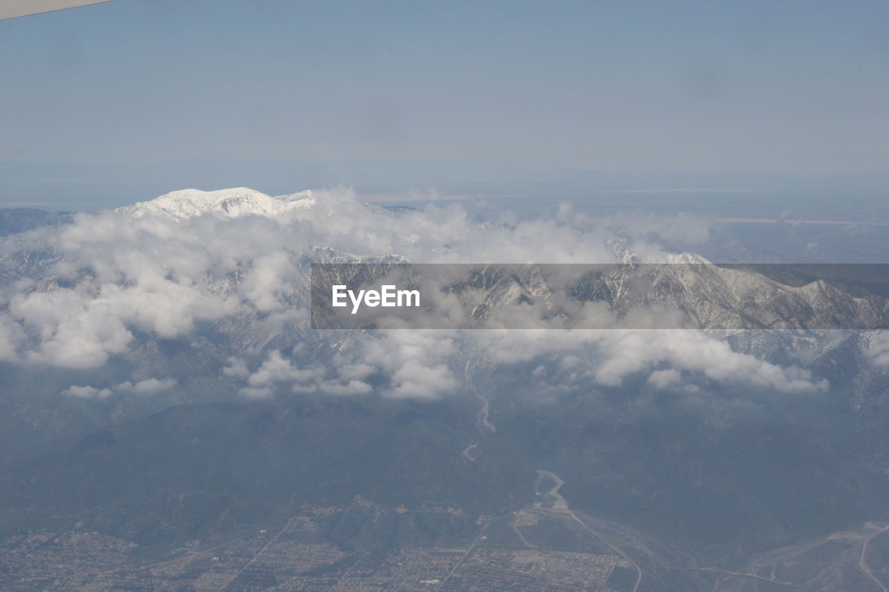 Scenic view of clouds over mountain against sky