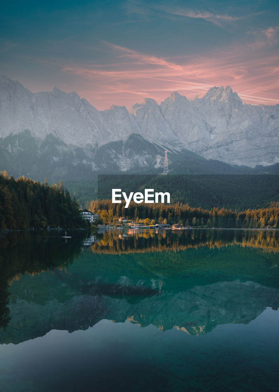 High angle view over lake eibsee with zugspitze mountains in background during sunset