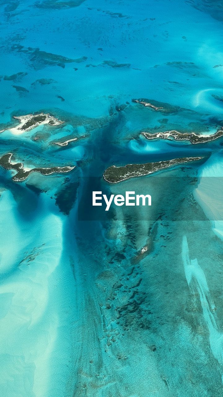 water, ocean, sea, nature, wind wave, no people, blue, land, high angle view, beauty in nature, marine biology, underwater, turquoise colored, outdoors, day, scenics - nature, wave, tranquility, atoll, aerial view, environment, beach, reef, swimming, animal, travel destinations, sand, sea life