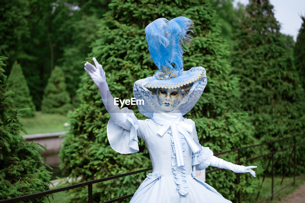 Woman in carnival dress mask