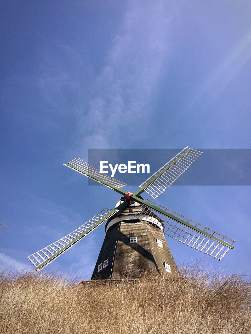Typican windmill from below with blue sky