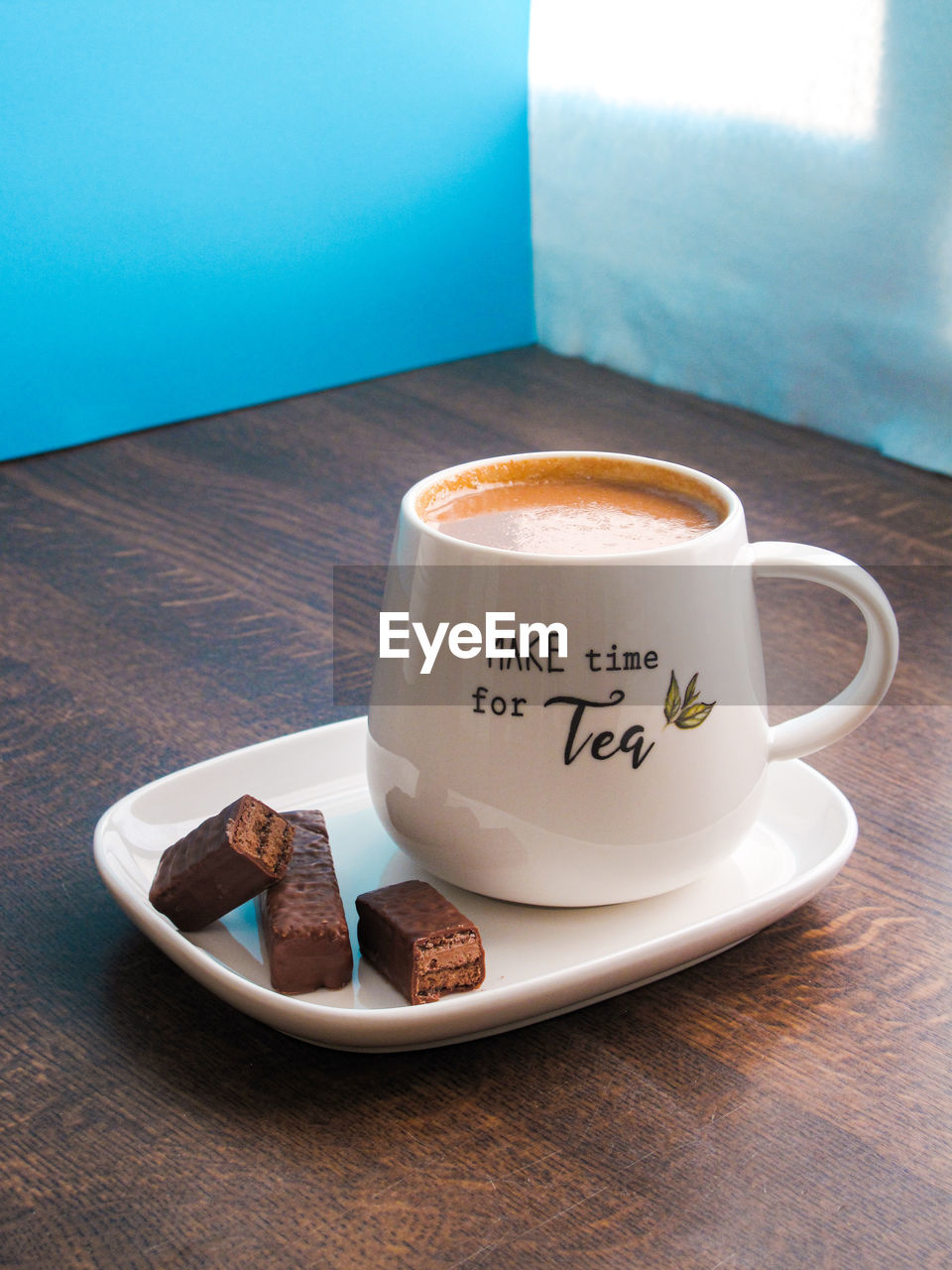 HIGH ANGLE VIEW OF COFFEE ON TABLE AT HOME