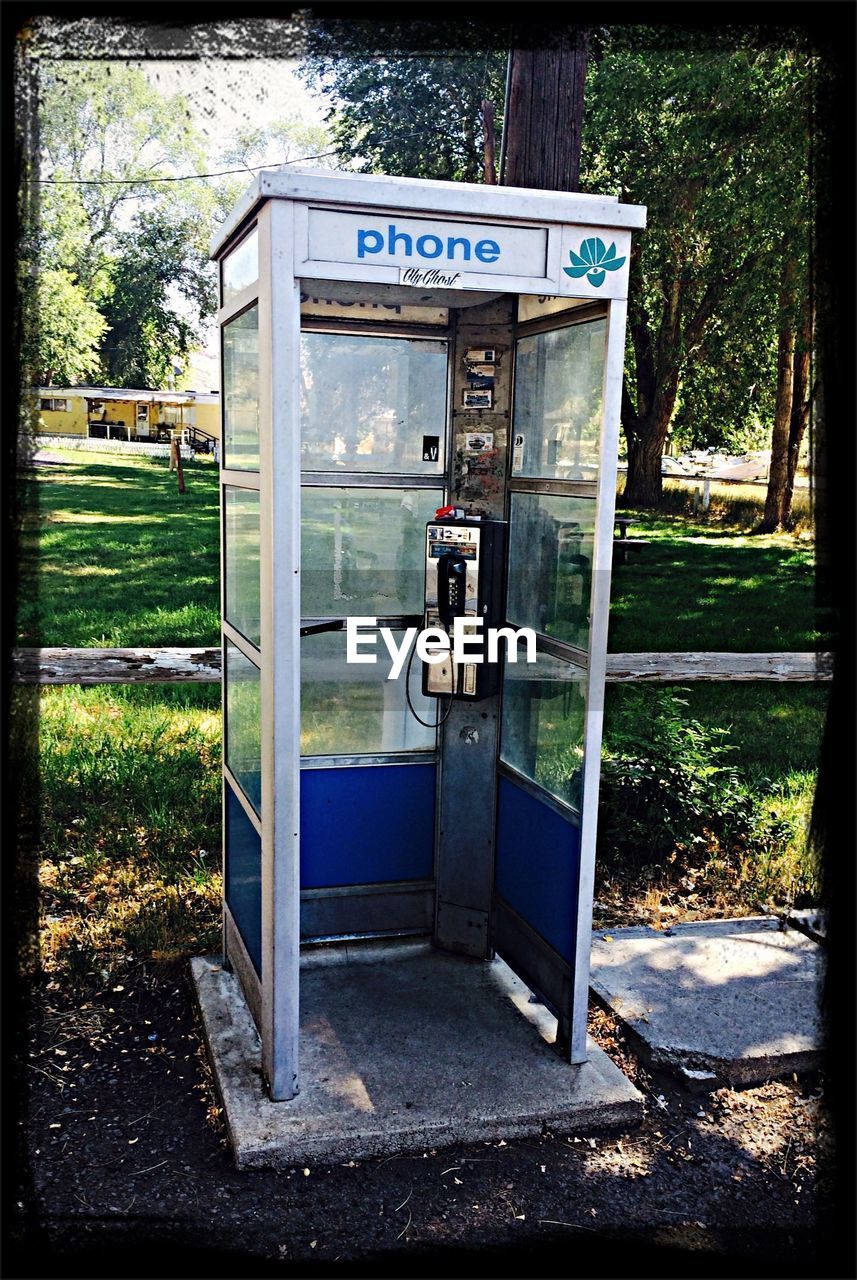 Open phone booth by street