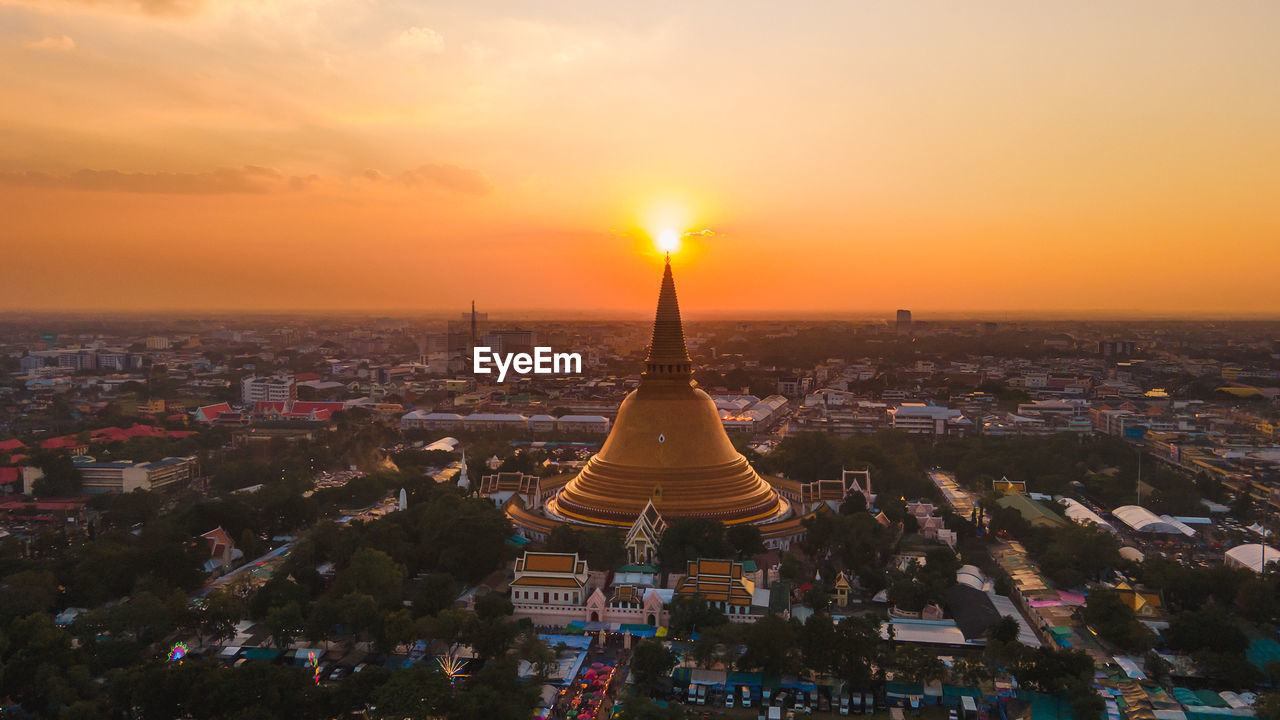 A massive golden pagoda located in the sunset community of phra pathom chedi, nakhon thailand