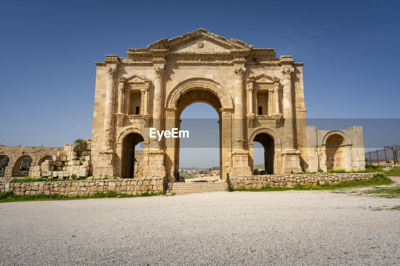 Arch of hadrian at the roman ruins of jerash, jordan.