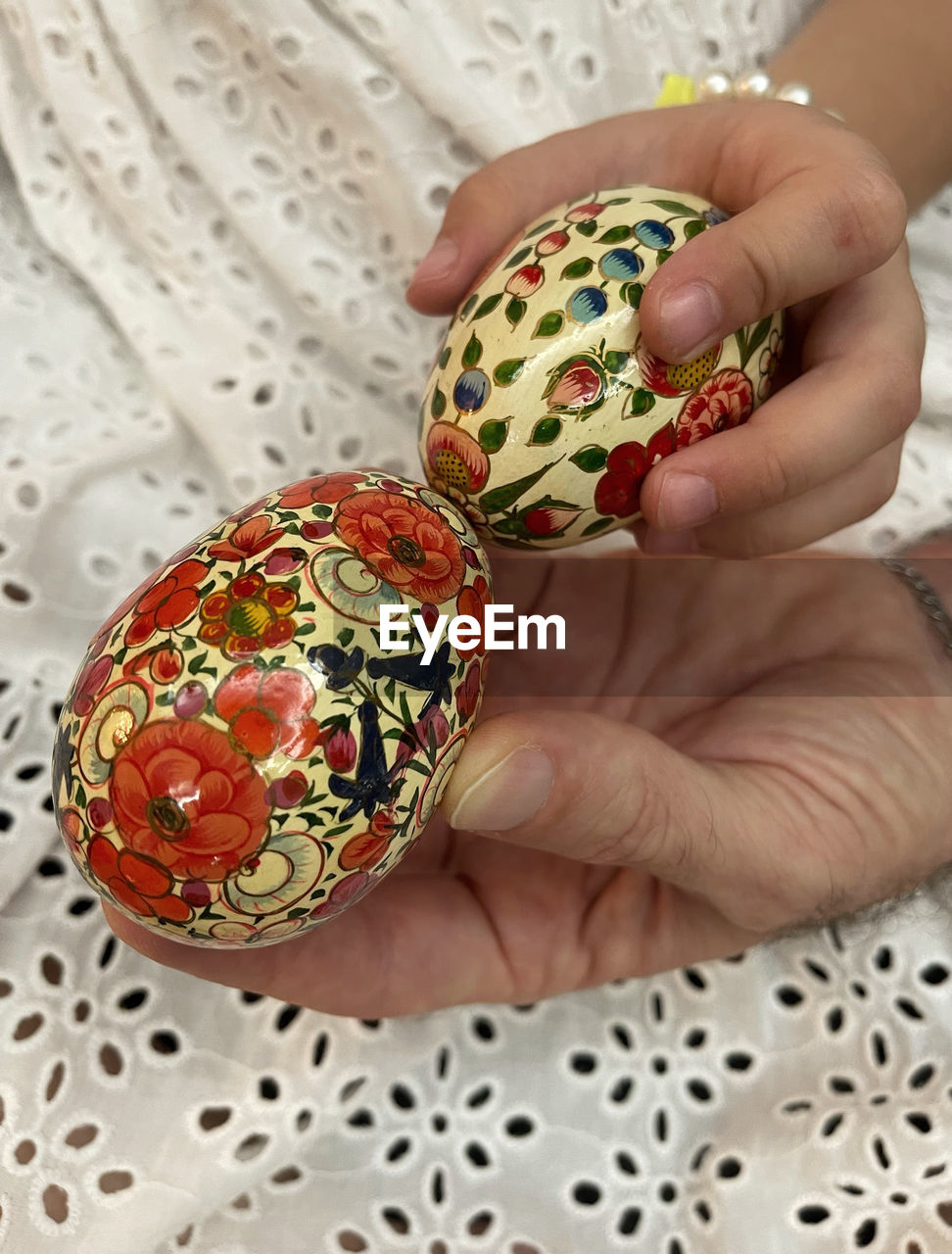 cropped hand of woman holding christmas decoration