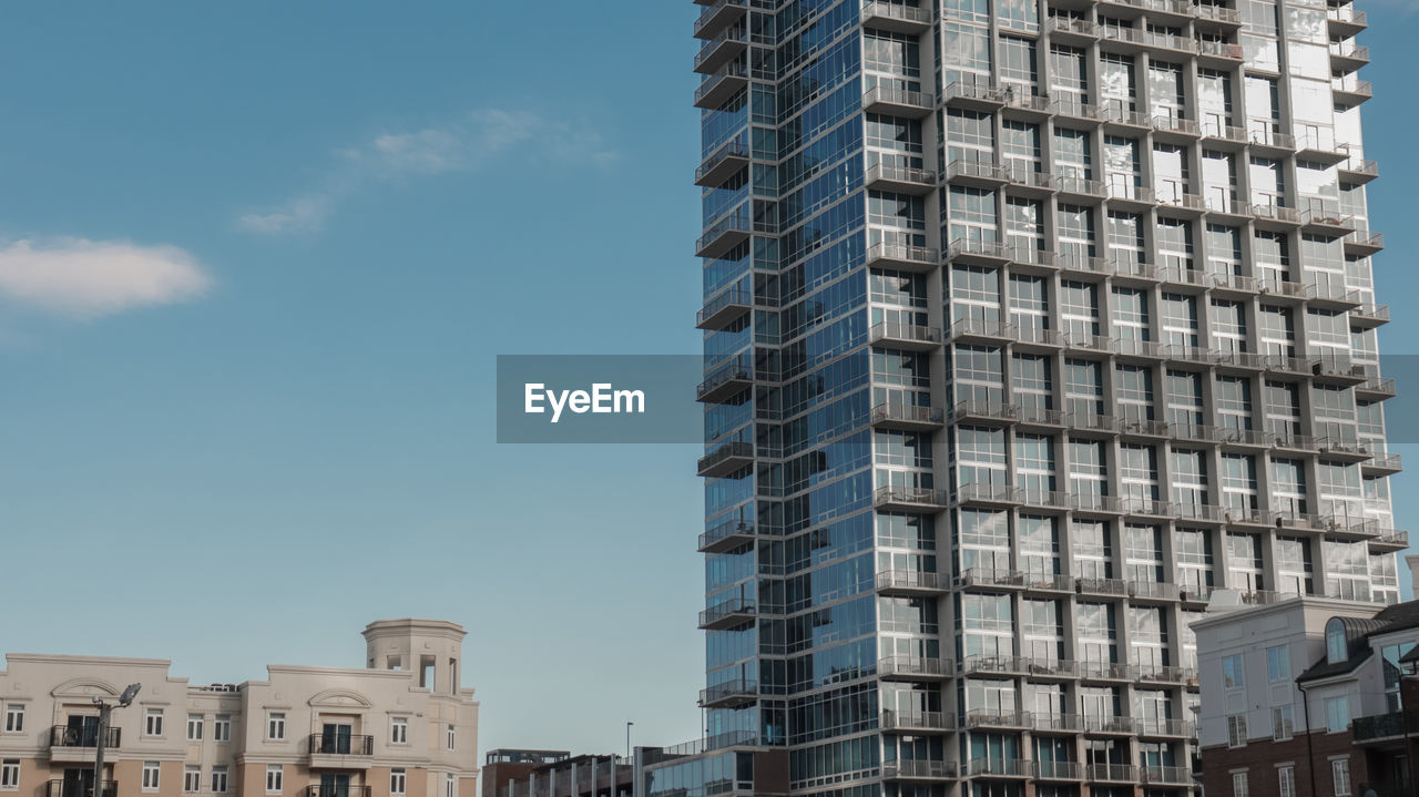 Low angle view of modern buildings against sky