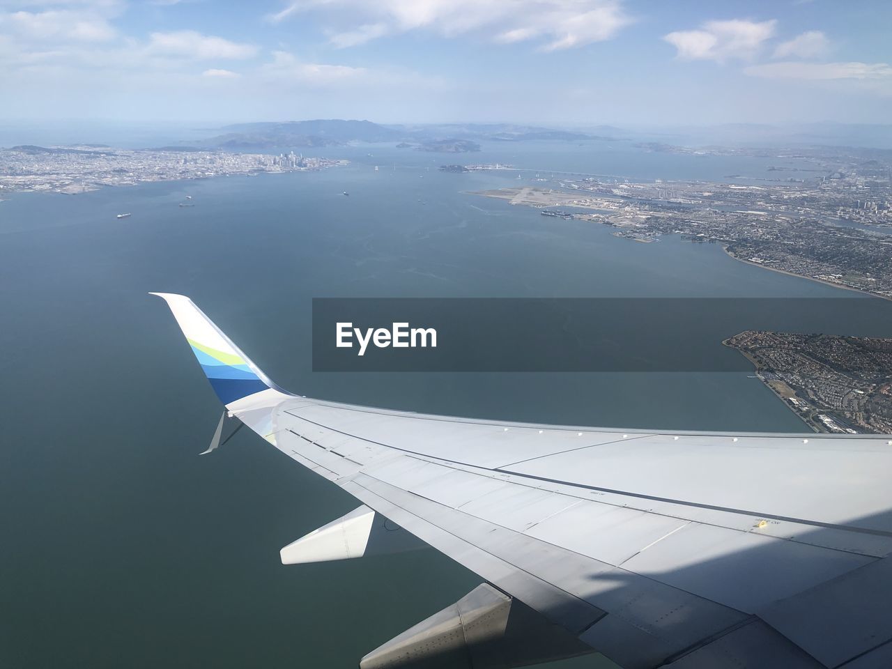 Aerial view of airplane flying in sky