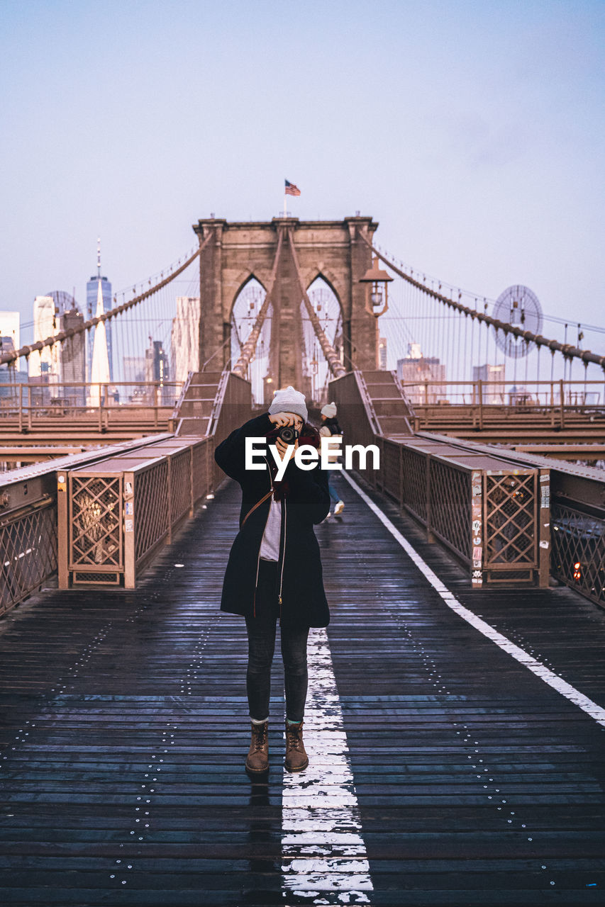 People standing on footbridge