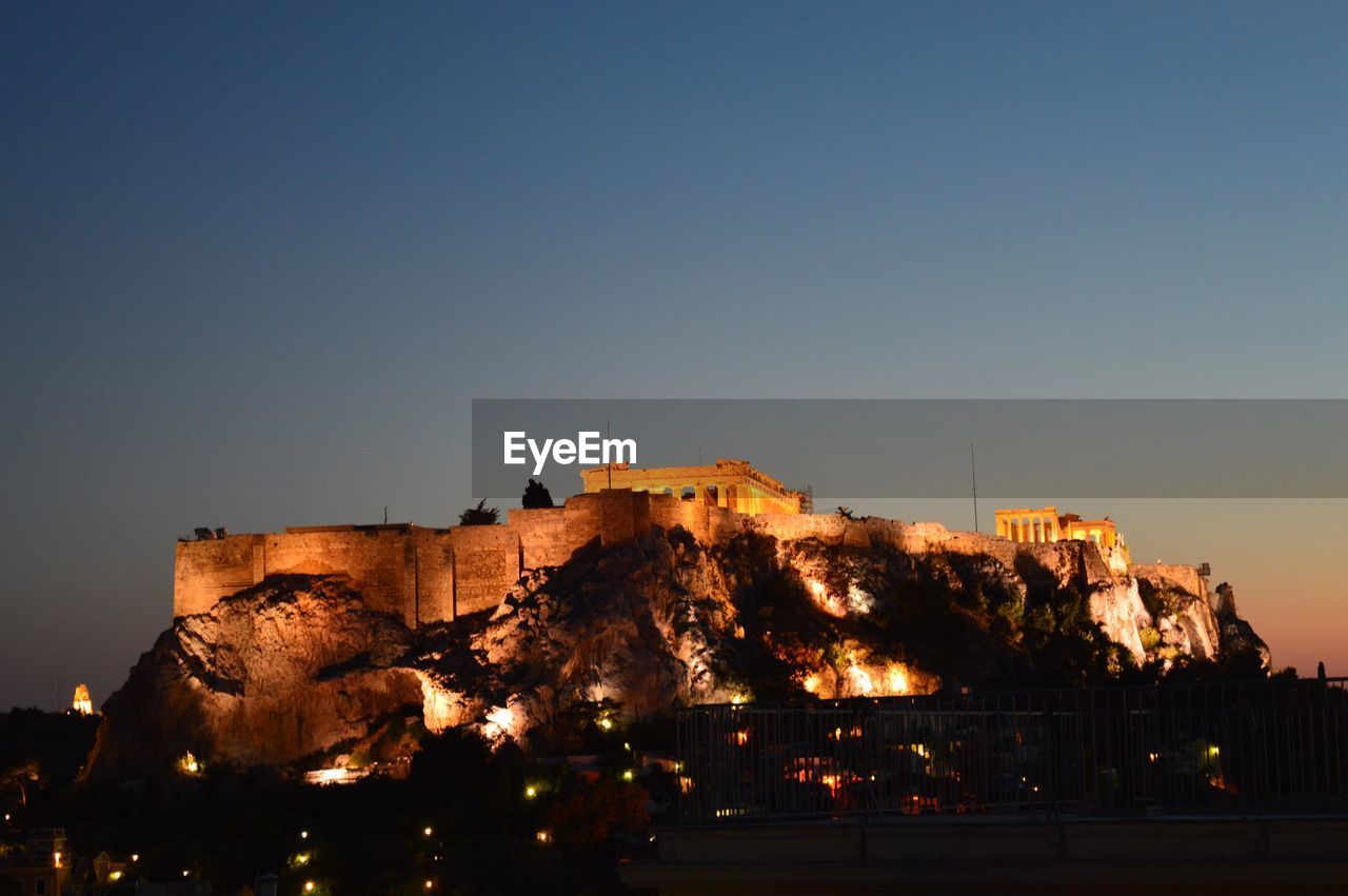 Low angle view of historical building against sky at night