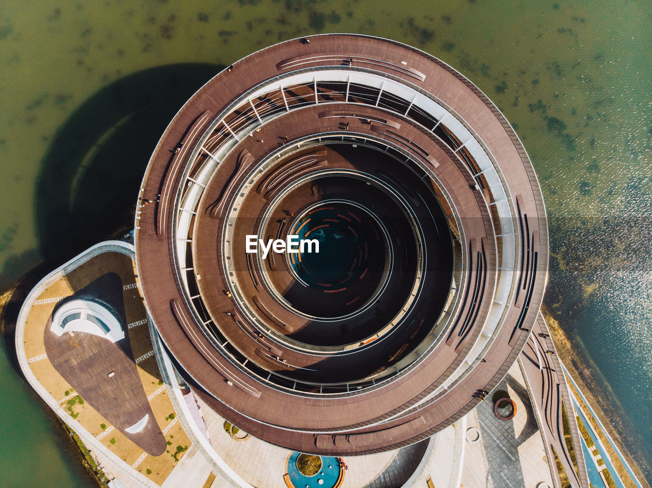 HIGH ANGLE VIEW OF SPIRAL STAIRCASE IN CONTAINER