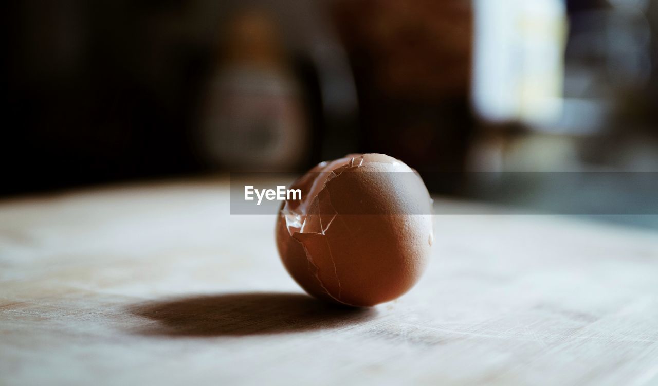 Close-up of broken eggshell on table