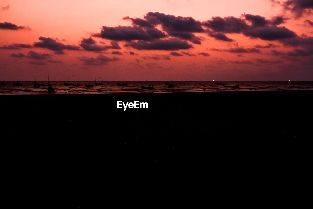 SCENIC VIEW OF BEACH DURING SUNSET