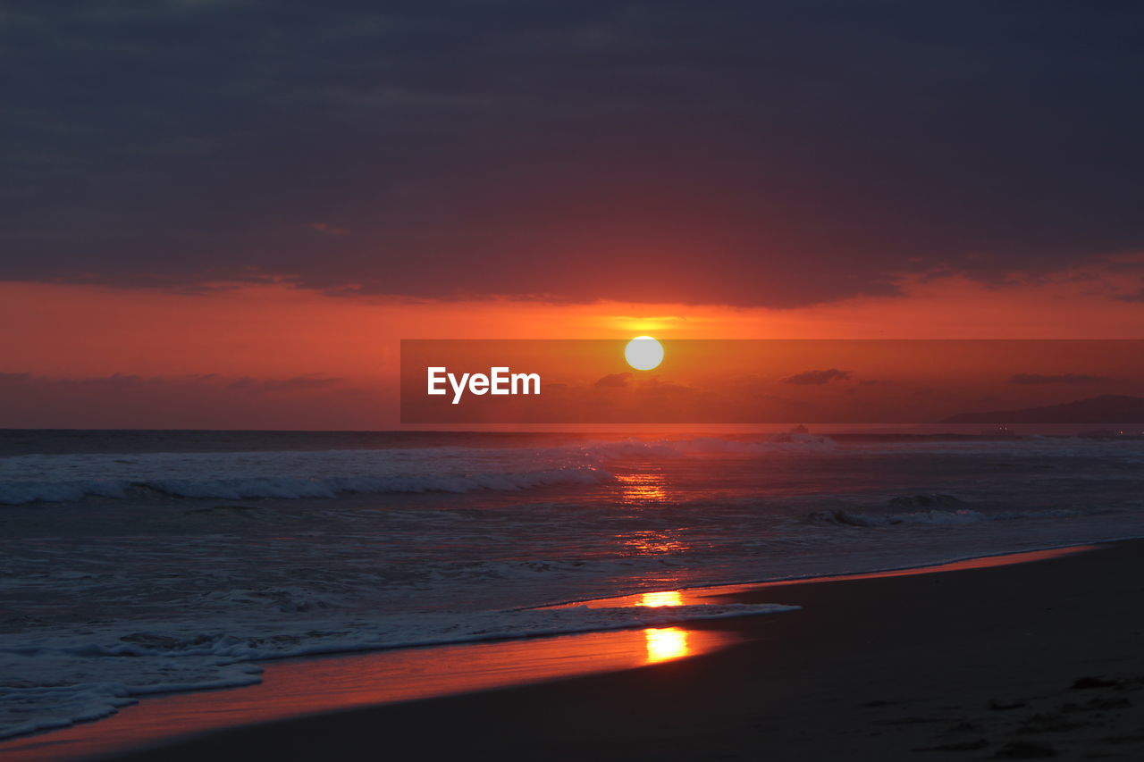 Scenic view of sea at sunset