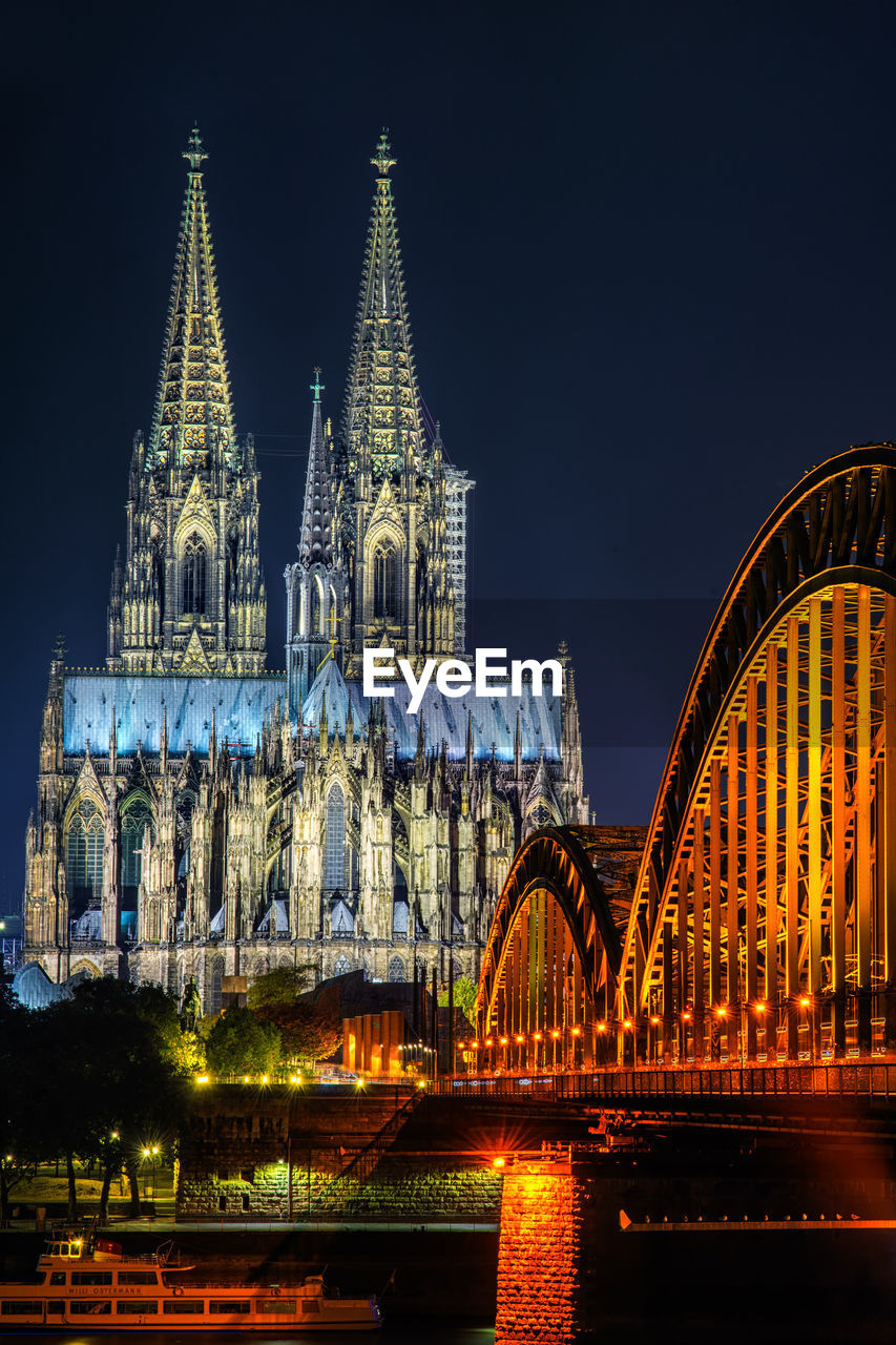 Illuminated cathedral against sky at night