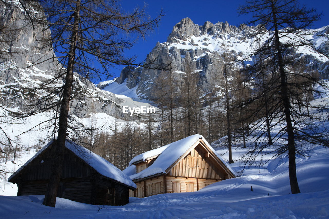 TENT ON SNOW COVERED LANDSCAPE