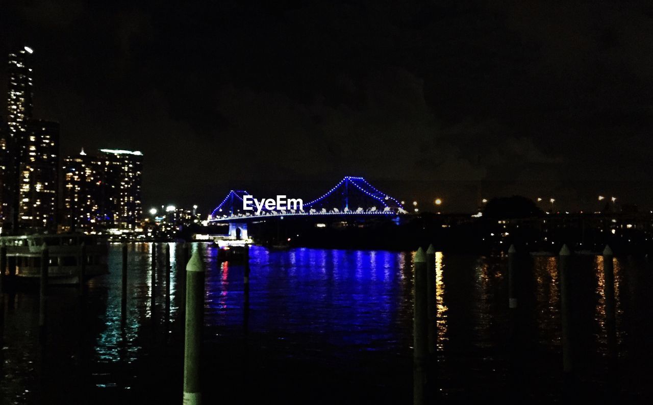 VIEW OF ILLUMINATED CITY AT NIGHT